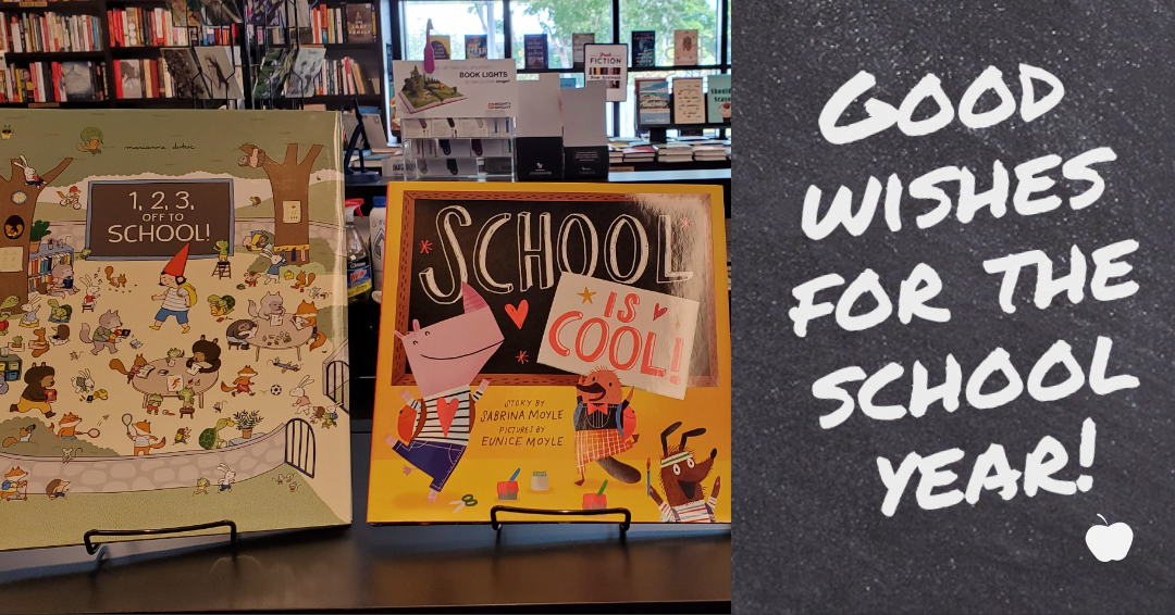 Two picture books in display stands at Books & Books @ The Studios, both with school as their subject, next to a faux chalkboard that reads, "Good wishes for the school year!'