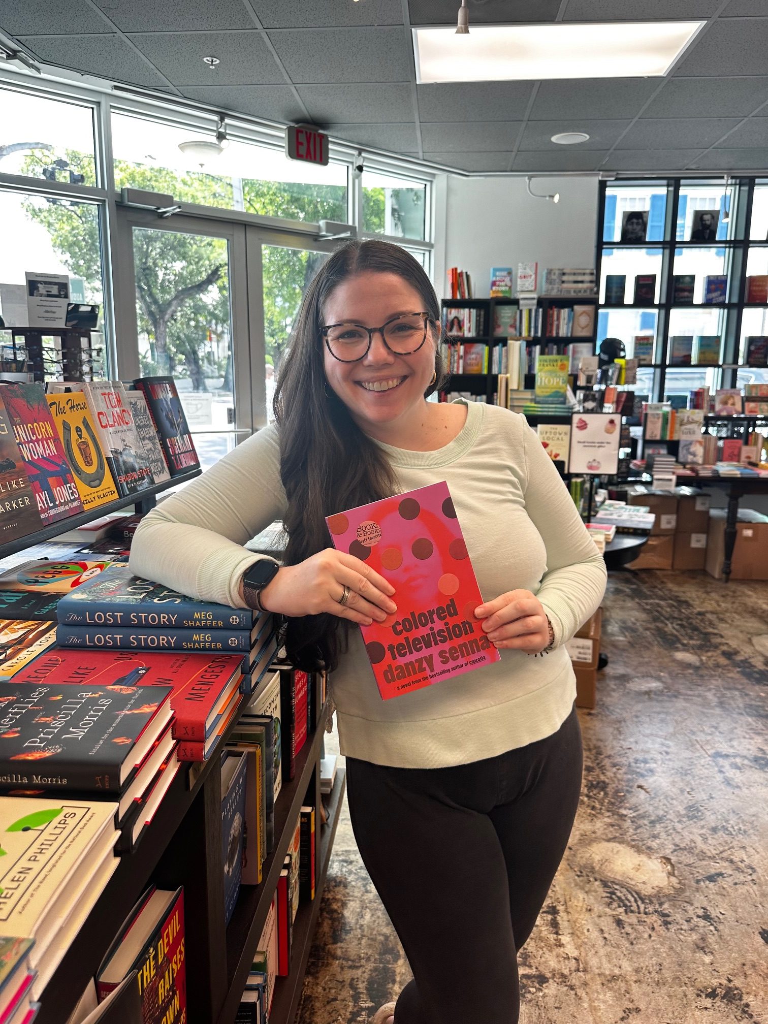 Emily with an ARC of Colored Television by Danzy Senna in the bookstore